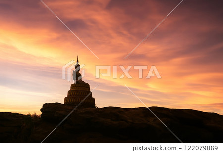 Buddha statue on the mountain in the morning light 122079089