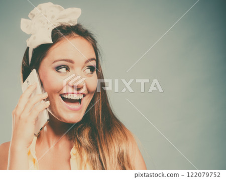Pretty pin up girl woman talking on mobile phone. Pretty pin up girl woman talking on mobile phone. 122079752