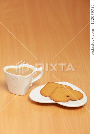 Gingerbread cookies and tea coffee on table. Gingerbread cookies and tea coffee on table. 122079753