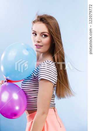 Woman summer joyful girl with colorful balloons Woman summer joyful girl with colorful balloons 122079772