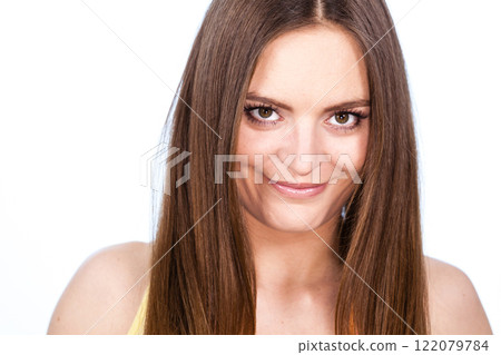 Portrait of beautiful young woman with brown hair 122079784