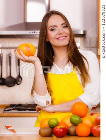 Beautiful lady in kitchen. 122079823