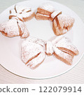 A close-up of trendy ribbon buns 122079914