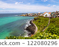 A beautiful view of Jeju Island's coastal road 122080296