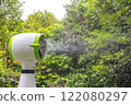 A cold air fan that spews liquid like mist, and a misting air cooler is turned on 122080297