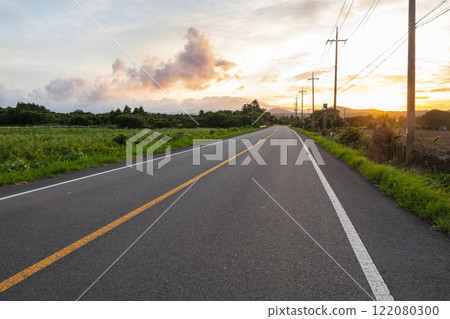 the setting sun on the roads of Jeju Island, Korea 122080300