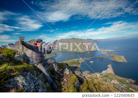 Amazing landscape of the Lofoten Islands from the top of Reinebringen Mountain with blue sky , county of Nordland, Norway. Amazing landscape of the Lofoten Islands from the top of Reinebringen Mountain with blue sky , county of Nordland, Norway. 122080685
