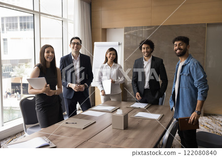 Portrait of five multinational professionals posing in modern office Portrait of five multinational professionals posing in modern office 122080840