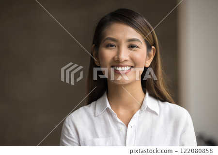 Closeup headshot portrait of young Asian businesswoman Closeup headshot portrait of young Asian businesswoman 122080858