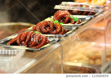 Whole octopus in sweet syrup sold at a food stall 122080859