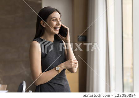 Young European businesswoman lead conversation on smartphone Young European businesswoman lead conversation on smartphone 122080884