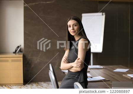 European businesslady in casual dress posing in meeting room 122080897