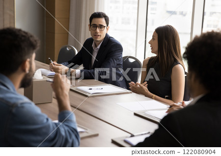 Group of serious professional businesspeople solve business-related issues Group of serious professional businesspeople solve business-related issues 122080904