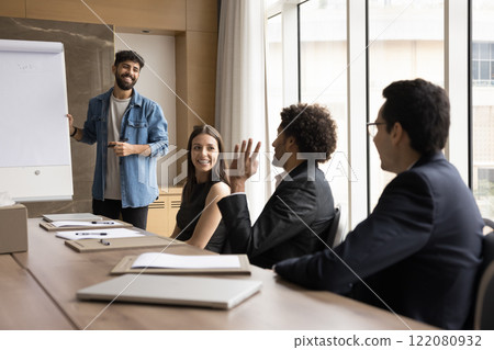 Seminar participant raise his arm to ask question 122080932