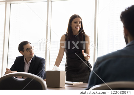 Smiling female executive manager hold formal meeting with shareholders 122080974