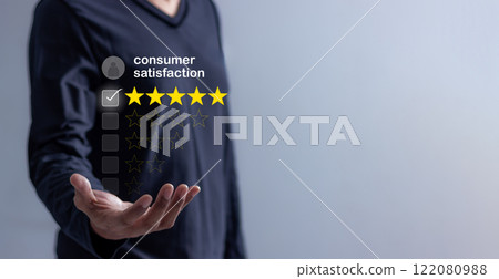 Young Man hand with five star to review and give 5 stars with very good results Young Man hand with five star to review and give 5 stars with very good results 122080988