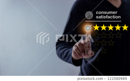 Young Man hand touching five star to review and give 5 stars with very good results Young Man hand touching five star to review and give 5 stars with very good results 122080989