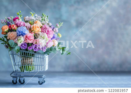 flowers of delicate shades look from a shopping cart on grey background, the concept of spring 122081957