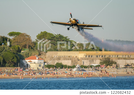 Stunt aerobatic plane performing stunts in air 122082432