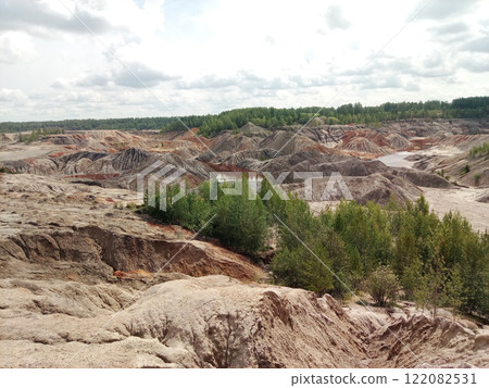 Quarry for the extraction of multi-colored clay in the Ural Mountains Quarry for the extraction of multi-colored clay in the Ural Mountains 122082531