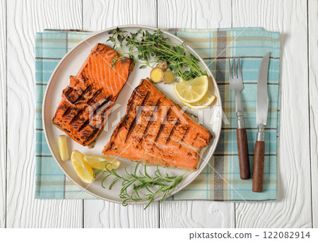 grilled salmon fish fillet with herbs, top view grilled salmon fish fillet with herbs, top view 122082914