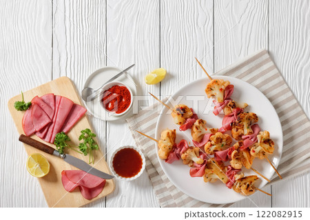 spicy cauliflower kebabs with corned beef on plate 122082915