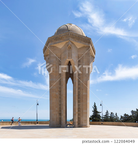 Eternal Flame Monument in Baku, Azerbaijan stands tall against a backdrop of a clear blue sky 122084049