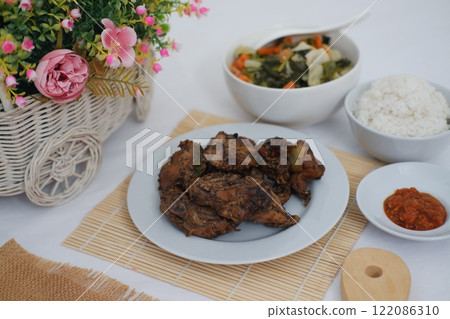 traditional Indonesian food arranged neatly on a table surface 122086310