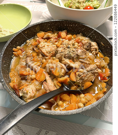 Braised rabbit with vegetables in pan. Food and healthy eating. Protein products. Braised rabbit with vegetables in pan. Food and healthy eating. Protein products. 122086449