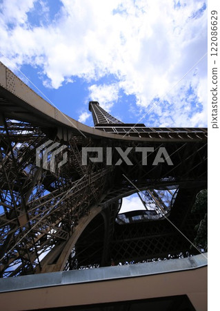 Looking up at the Eiffel Tower from below 122086629