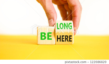 Belonging and belong symbol. Concept words Be here Belong on beautiful wooden block. Beautiful white background Businessman hand. Business motivational belonging and belong concept. Copy space. 122086820