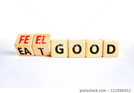 Eat and feel good symbol. Concept words Eat good Feel good on wooden cubes. Beautiful white table white background. Healthy lifestyle eat and feel good concept. Copy space. Eat and feel good symbol. Concept words Eat good Feel good on wooden cubes. Beautiful white table white background. Healthy lifestyle eat and feel good concept. Copy space. 122086852