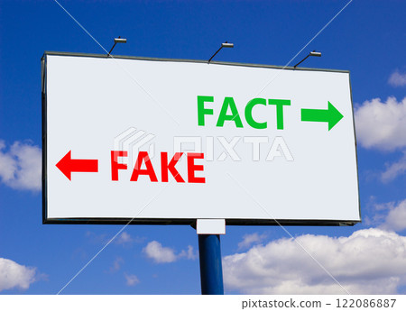 Fact or fake symbol. Concept word Fake and Fact on beautiful billboard with two arrows. Beautiful blue sky with clouds background. Business and fact or fake concept. Copy space. Fact or fake symbol. Concept word Fake and Fact on beautiful billboard with two arrows. Beautiful blue sky with clouds background. Business and fact or fake concept. Copy space. 122086887