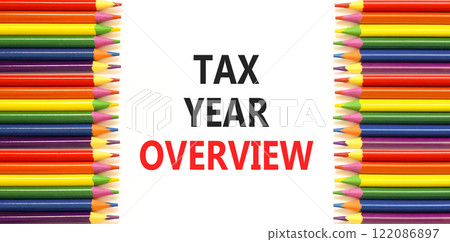 Tax year overview symbol. Concept words Tax year overview on beautiful white paper. Beautiful white background. Colored pencils. Business tax year overview concept. Copy space. 122086897