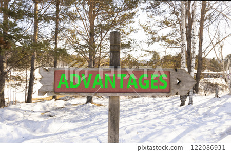 Advantages symbol. Concept word Advantages on beautiful wooden road sign. Beautiful winter forest background. Business advantages concept. Copy space. 122086931