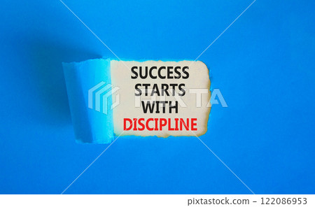 Success starts with discipline symbol. Concept words Success starts with discipline on beautiful white paper. Beautiful blue background. Business success starts with discipline concept. Copy space 122086953