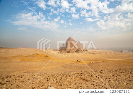 Egypt. Cairo - Giza. General view of pyramids from the Giza Plateau (three pyramids known as Queens' Pyramids on front side; next in order from left: the Pyramid of Menkaure, Khafre and Chufu Egypt. Cairo - Giza. General view of pyramids from the Giza Plateau (three pyramids known as Queens' Pyramids on front side; next in order from left: the Pyramid of Menkaure, Khafre and Chufu 122087121