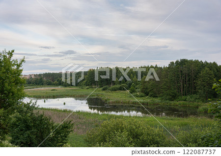 Summer landscape. Forest lake. Pond among green trees. Summer landscape. Forest lake. Pond among green trees. 122087737