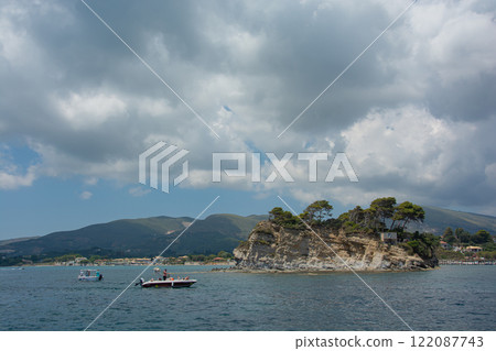 Laganas, Greece - 06/11/2016: Seascape. Motor boats near the island Laganas, Greece - 06/11/2016: Seascape. Motor boats near the island 122087743