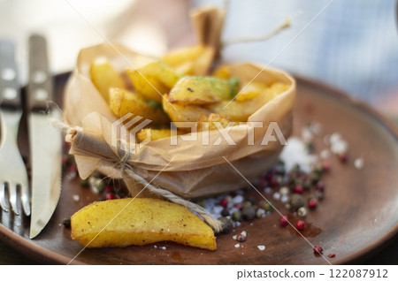 Fried potatoes with spices in a rural style 122087912