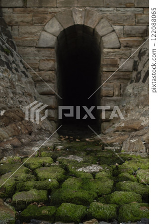 The old moss-covered stone road to the tunnel 122088065