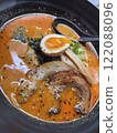 Japanese ramen noodle soup in black bowl, close up 122088096