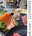 Salmon and tuna Sashimi on black plate in restaurant 122088098
