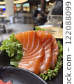 Salmon sashimi on black plate, japanese food in restaurant. 122088099