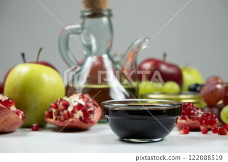 Balsamic vinegar on the background of fruits and other types of vinegars. 122088519