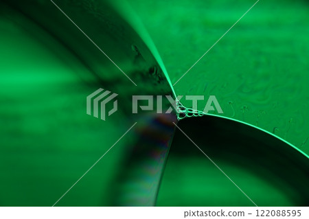 Green liquid surface, fantastic bubbles in the darkness, dark fantastic background, transparent forms, empty space, dark background Green liquid surface, fantastic bubbles in the darkness, dark fantastic background, transparent forms, empty space, dark background 122088595