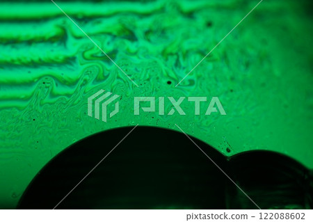 Green liquid surface, fantastic bubbles in the darkness, dark fantastic background, transparent forms, empty space, dark background Green liquid surface, fantastic bubbles in the darkness, dark fantastic background, transparent forms, empty space, dark background 122088602
