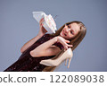Celebration Fashion A Glamorous Girl Posing with a Beautiful Cake while Wearing High Heels 122089038
