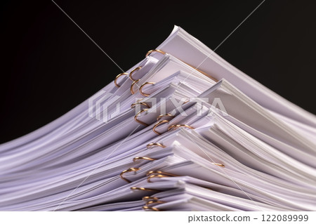 white blank sheets of paper connected by copper staples white blank sheets of paper connected by copper staples 122089999