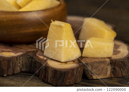 pumpkin pulp in a wooden bowl on the table 122090008